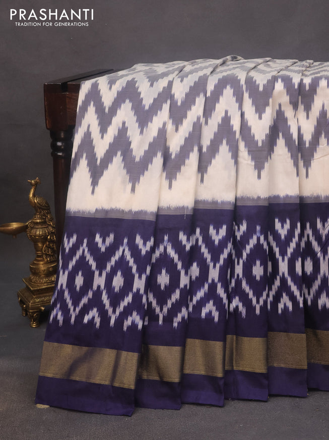 Pochampally silk saree off white and navy blue with allover zig zag weaves and zari woven border