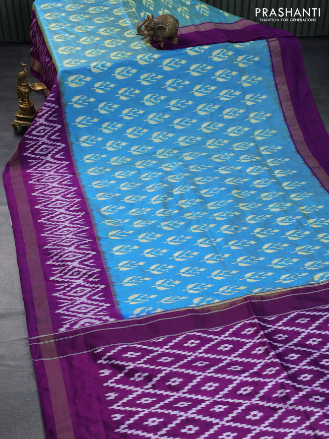 Pochampally silk saree dual shade of cs blue and deep purple with allover ikat butta weaves and long ikat woven zari border