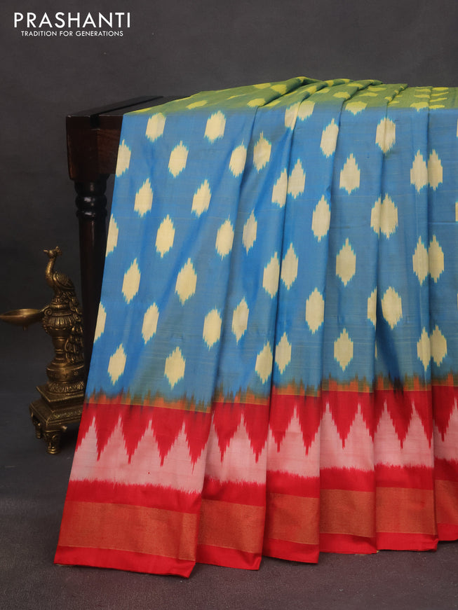 Pochampally silk saree dual shade of cs blue and red with allover ikat butta weaves and zari woven border