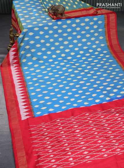 Pochampally silk saree dual shade of cs blue and red with allover ikat butta weaves and zari woven border