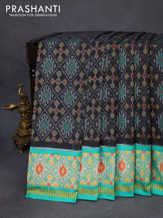 Pochampally silk saree black and teal green with allover ikat weaves and ikat woven zari border