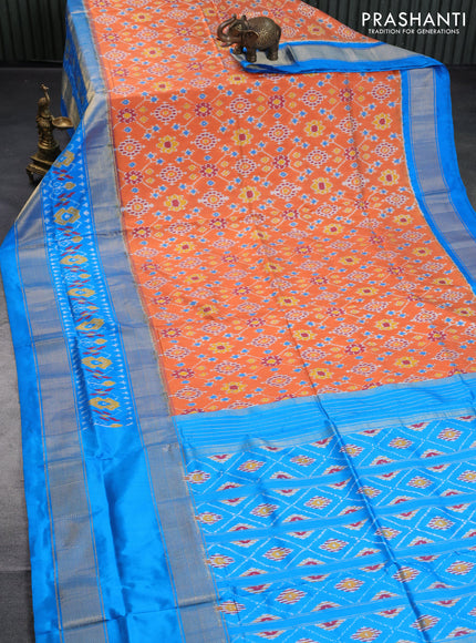 Pochampally silk saree orange and cs blue with allover ikat weaves and long zari woven ikat border