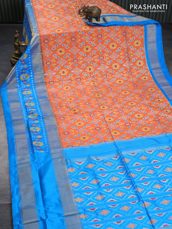 Pochampally silk saree orange and cs blue with allover ikat weaves and long zari woven ikat border