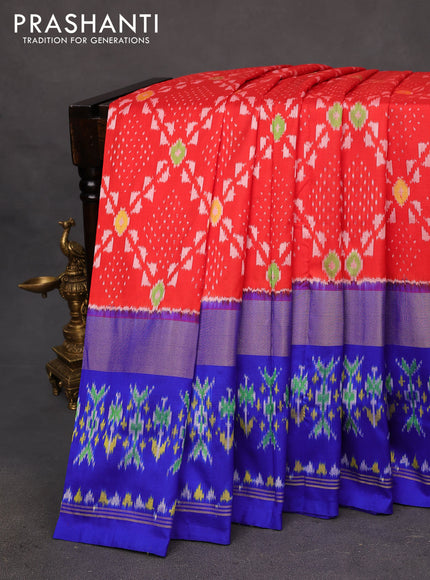 Pochampally silk saree orange and royal blue with allover ikat weaves and zari woven ikat style border