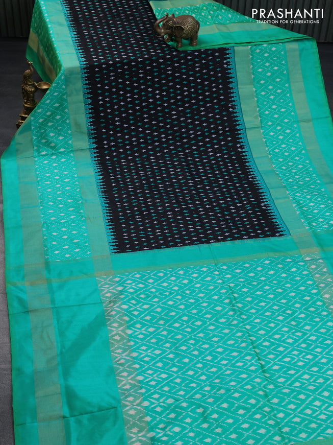 Pochampally silk saree black and teal green shade with allover ikat butta weaves and long zari woven ikat style border