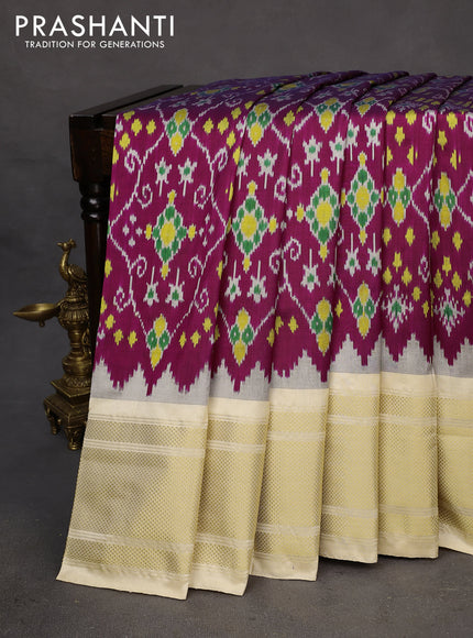 Pochampally silk saree dark magenta pink and cream with allover ikat weaves and temple design zari woven border