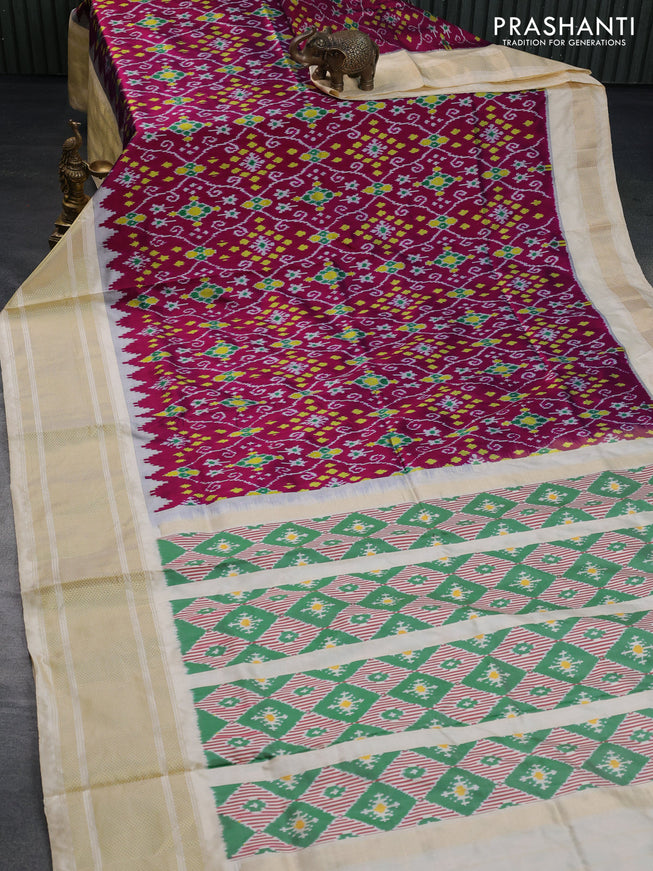 Pochampally silk saree dark magenta pink and cream with allover ikat weaves and temple design zari woven border