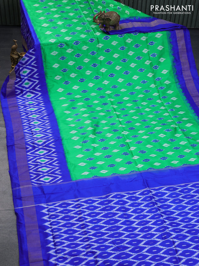 Pochampally silk saree green and royal blue with allover ikat butta weaves and long ikat woven zari border