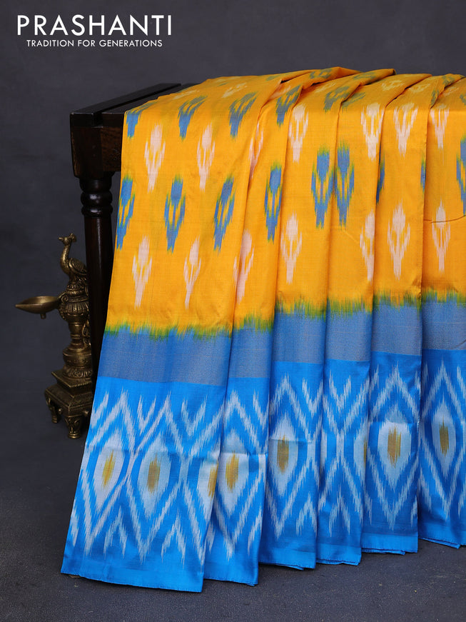 Pochampally silk saree yellow and cs blue with allover ikat butta weaves and long zari woven ikat style border