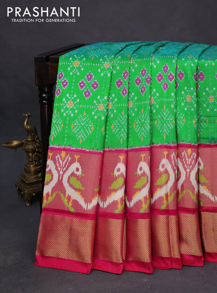 Pochampally silk saree green and reddish pink with allover ikat weaves and long ikat woven zari border