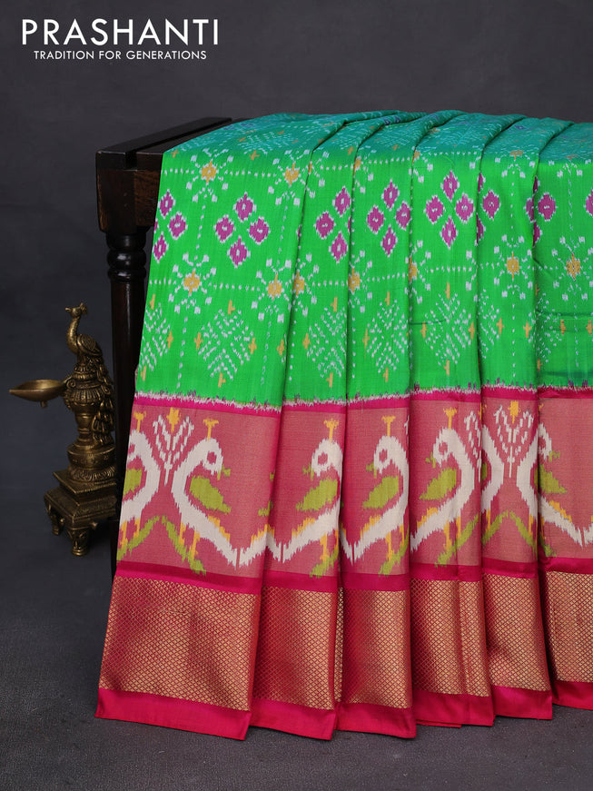 Pochampally silk saree green and reddish pink with allover ikat weaves and long ikat woven zari border