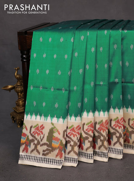 Pochampally silk saree teal green and cream with allover ikat butta weaves and temple design ikat woven zari border