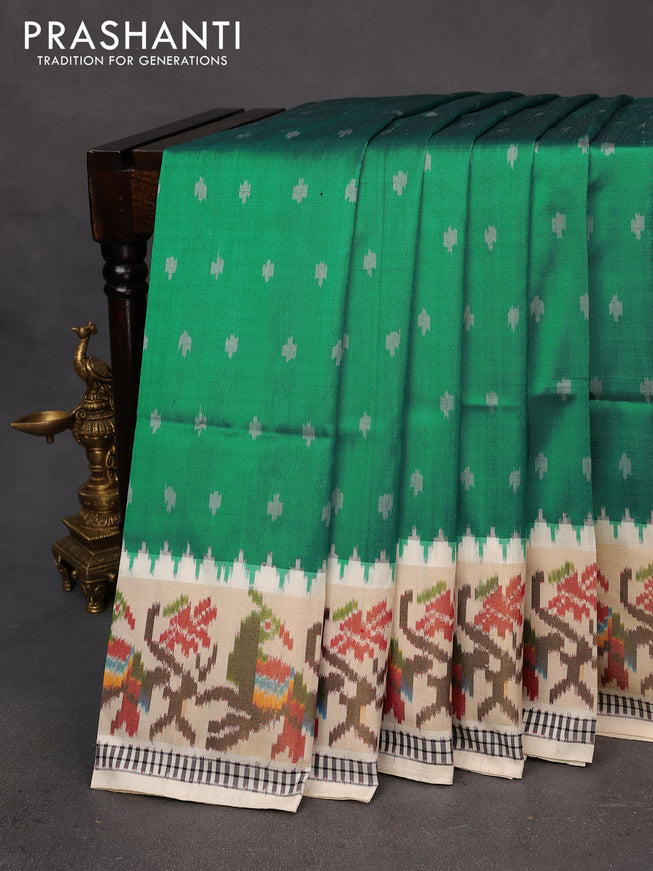 Pochampally silk saree teal green and cream with allover ikat butta weaves and temple design ikat woven zari border