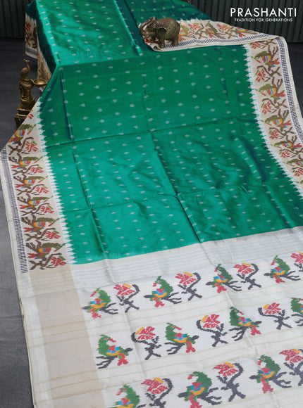 Pochampally silk saree teal green and cream with allover ikat butta weaves and temple design ikat woven zari border