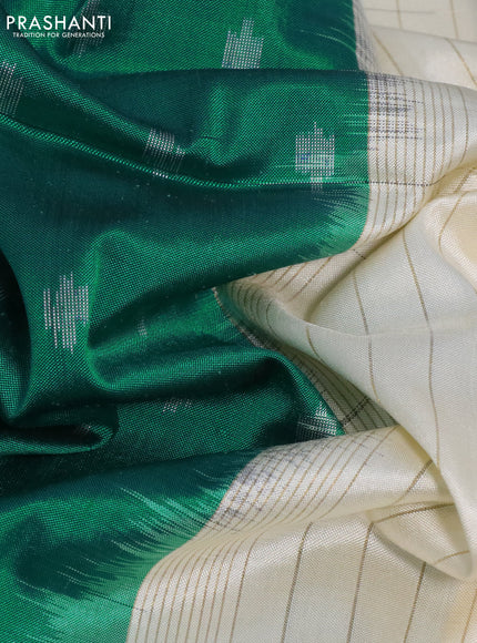 Pochampally silk saree teal green and cream with allover ikat butta weaves and temple design ikat woven zari border