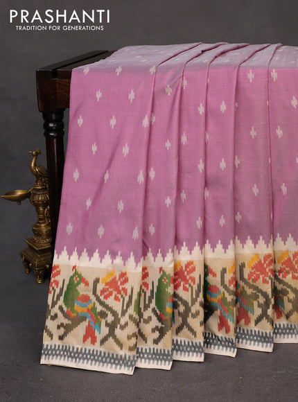 Pochampally silk saree lotus pink and cream with allover ikat butta weaves and temple design ikat woven zari border