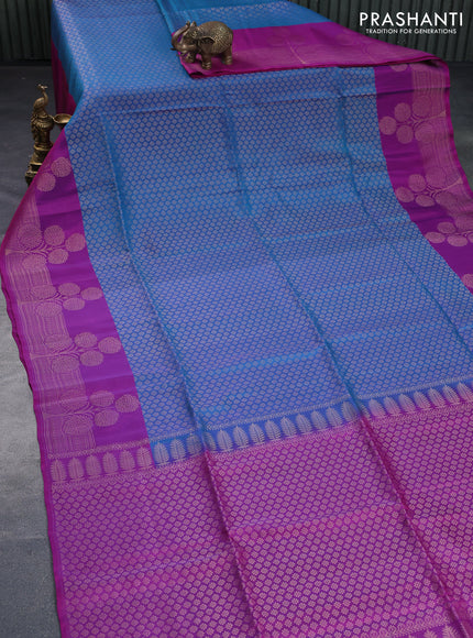 Kanchipuram soft silk saree dual shade of cs blue and purple with allover zari woven brocade weaves and floral deisgn zari woven border