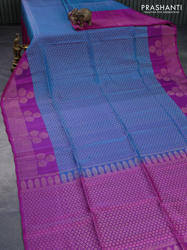 Kanchipuram soft silk saree dual shade of cs blue and purple with allover zari woven brocade weaves and floral deisgn zari woven border