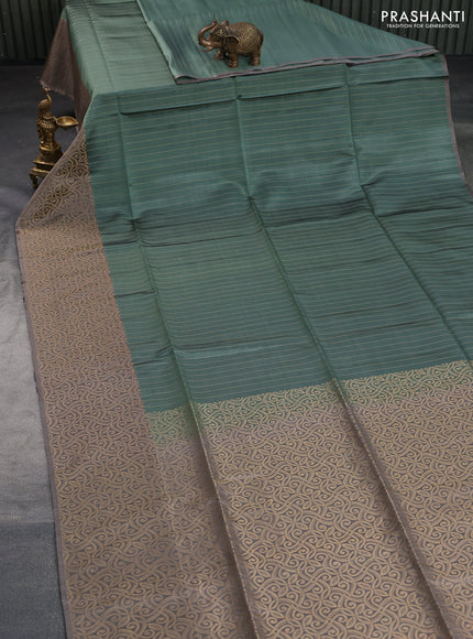 Kanchipuram soft silk saree pastel green and grey with allover zari stripe weaves and long zari woven border