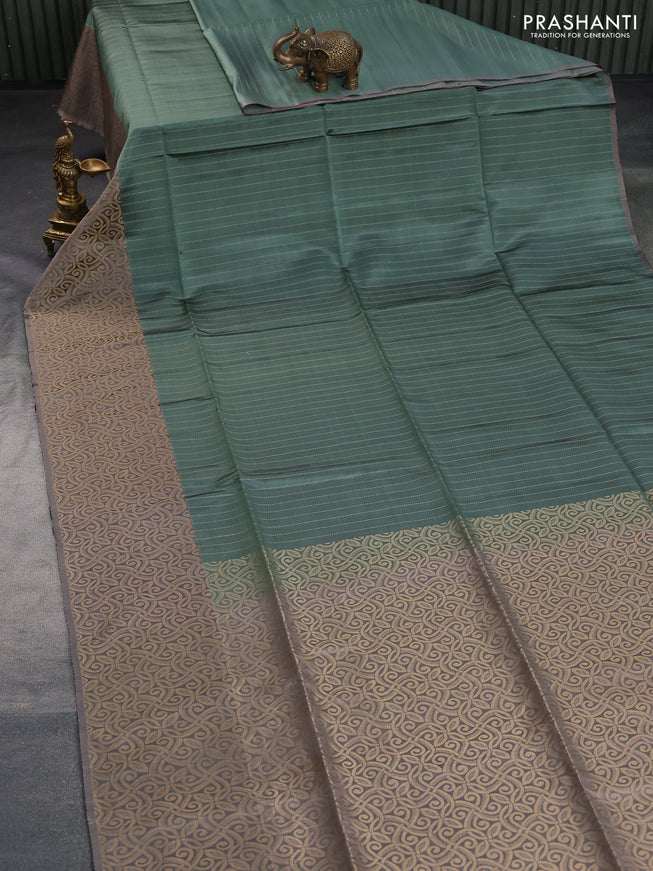 Kanchipuram soft silk saree pastel green and grey with allover zari stripe weaves and long zari woven border