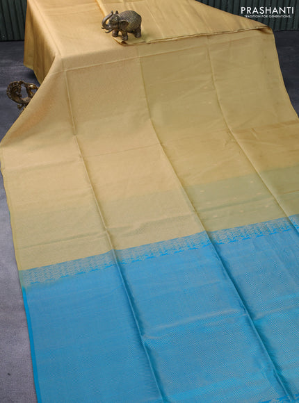 Kanchipuram soft silk saree sandal and dual shade of teal blue with half and half style and long zari woven border