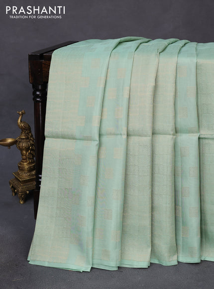 Kanchipuram soft silk saree pastel green and dual shade of pinkish orange with half and half style and long zari woven border