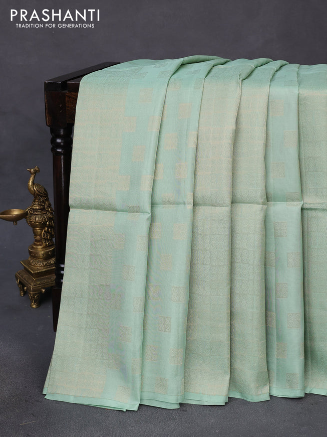 Kanchipuram soft silk saree pastel green and dual shade of pinkish orange with half and half style and long zari woven border