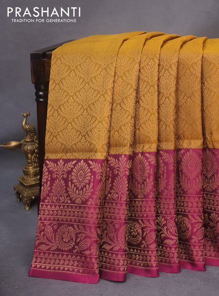 Kanchipuram soft silk saree dark mustard and magenta pink with allover zari woven brocade weaves and long zari woven border