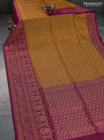 Kanchipuram soft silk saree dark mustard and magenta pink with allover zari woven brocade weaves and long zari woven border