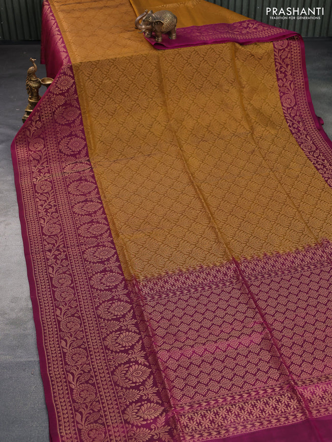 Kanchipuram soft silk saree dark mustard and magenta pink with allover zari woven brocade weaves and long zari woven border