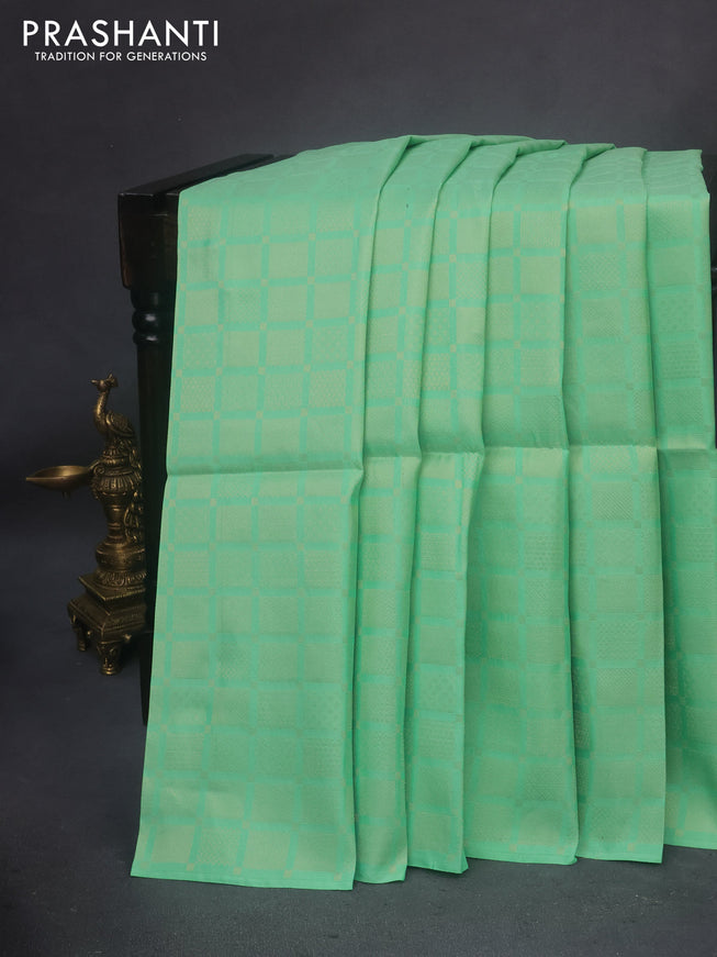 Kanchipuram soft silk saree pastel green and mild peach shade with allover zari woven brocade weaves in borderless style