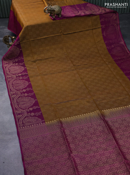 Kanchipuram soft silk saree dark mustard and magenta pink with allover zari weaves and zari woven border