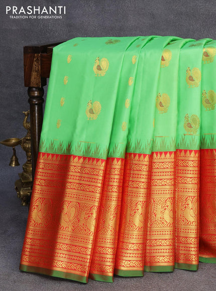 Pure gadwal silk saree light green and red with zari woven buttas and temple design annam zari woven border