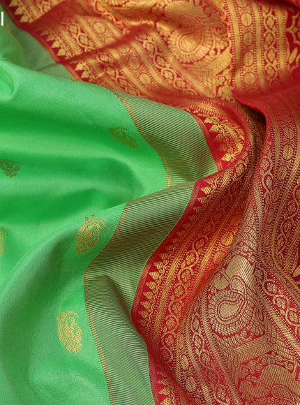 Pure gadwal silk saree light green and red with zari woven buttas and temple design annam zari woven border