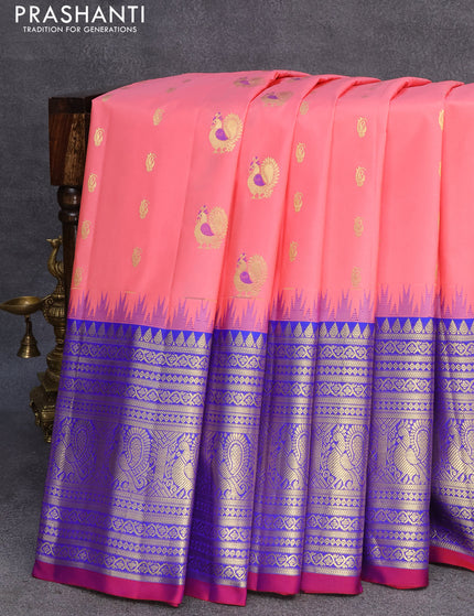 Pure gadwal silk saree peach pink and blue with zari woven buttas and temple design long zari woven border