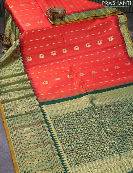 Pure gadwal silk saree orange and green with zari woven buttas and temple design long zari woven border