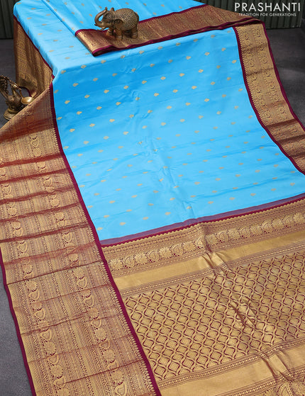 Pure gadwal silk saree light blue and dark magenta pink with zari woven buttas and zari woven border