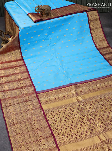 Pure gadwal silk saree light blue and dark magenta pink with zari woven buttas and zari woven border