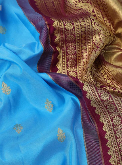 Pure gadwal silk saree light blue and dark magenta pink with zari woven buttas and zari woven border