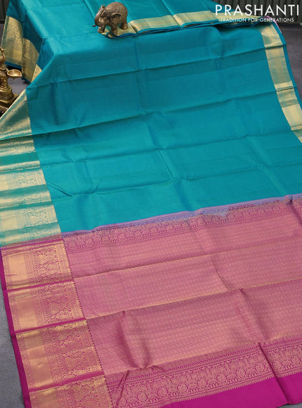 Pure kanjivaram silk saree teal blue and purple with allover zari weaves and long zari woven border & Allover wevaes