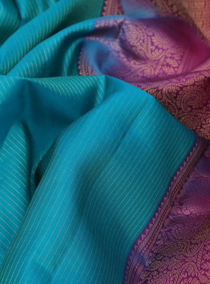 Pure kanjivaram silk saree teal blue and purple with allover zari weaves and long zari woven border & Allover wevaes