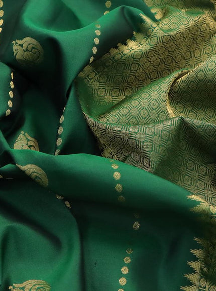 Pure kanjivaram silk saree green and dual shade of pinkish orange with annam zari woven buttas and zari woven border & Butta style