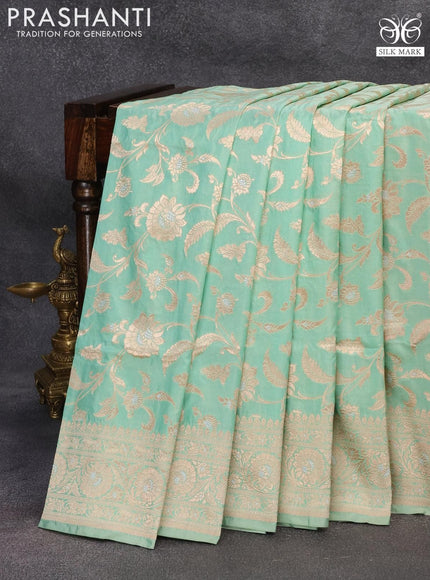 Banarasi uppada silk saree pastel green shade with allover floral zari woven brocade weaves and rich floral zari woven border