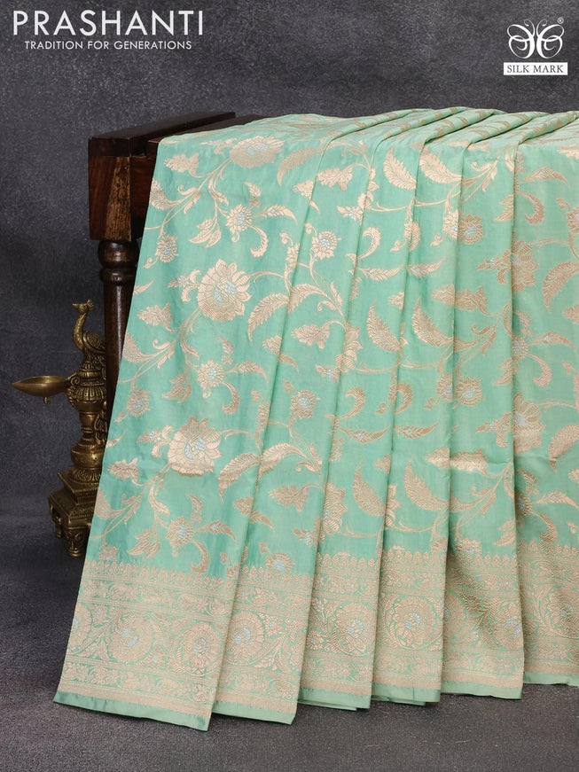 Banarasi uppada silk saree pastel green shade with allover floral zari woven brocade weaves and rich floral zari woven border