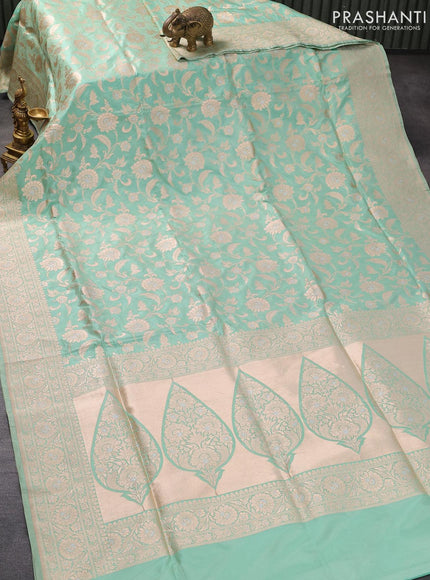 Banarasi uppada silk saree pastel green shade with allover floral zari woven brocade weaves and rich floral zari woven border