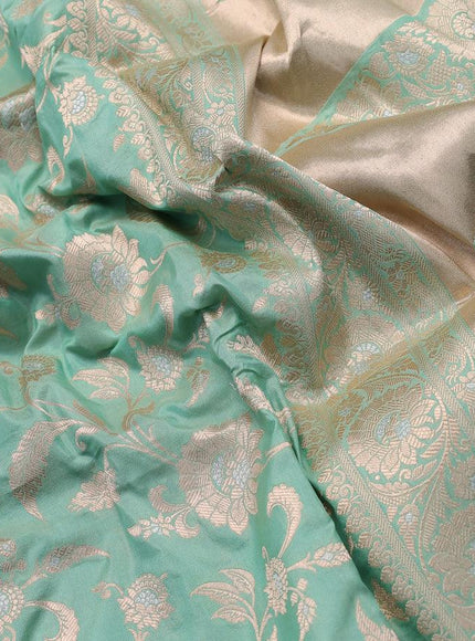 Banarasi uppada silk saree pastel green shade with allover floral zari woven brocade weaves and rich floral zari woven border