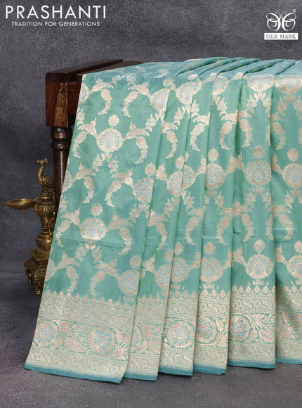 Banarasi uppada silk saree dual shade of teal blue with allover zari woven floral brocade weaves and zari woven floral border