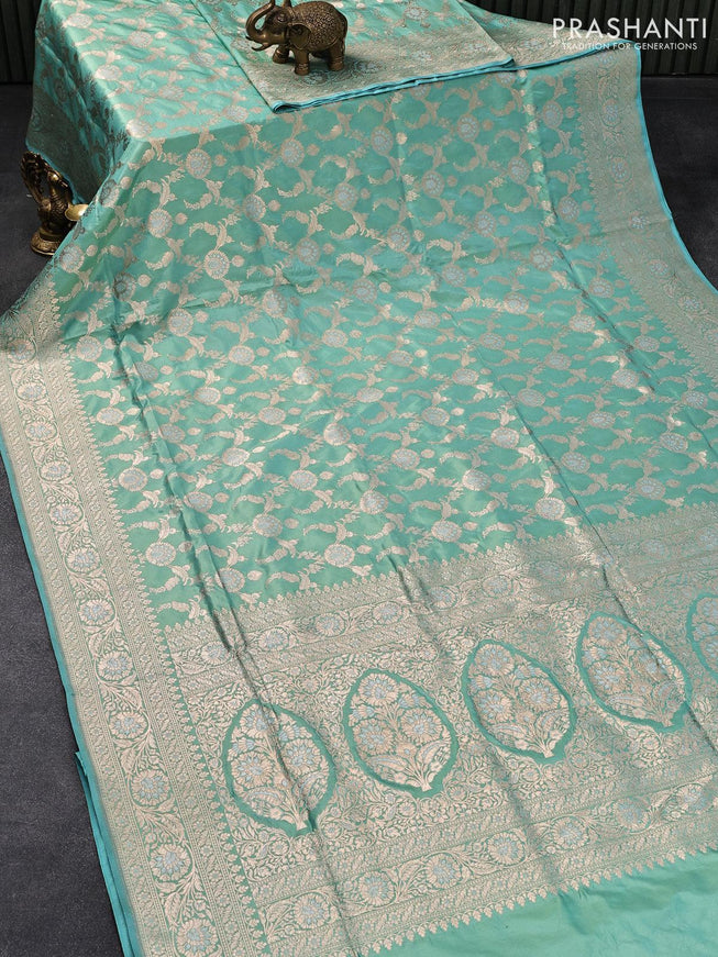 Banarasi uppada silk saree dual shade of teal blue with allover zari woven floral brocade weaves and zari woven floral border