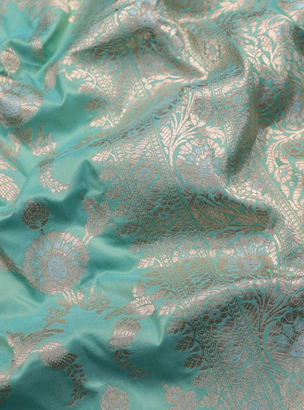 Banarasi uppada silk saree dual shade of teal blue with allover zari woven floral brocade weaves and zari woven floral border