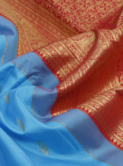 Pure gadwal silk saree light blue and red with allover zari woven buttas and temple design long annam zari woven border